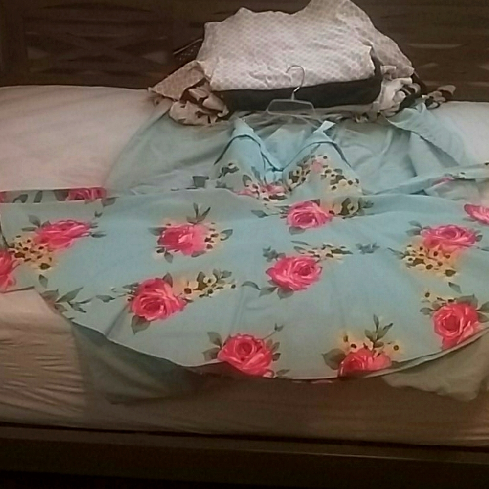 Blue dress with pink and yellow flowers.